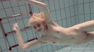 Blonde babe Okuneva shaved pussy underwater swimming