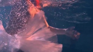 Bulava Lozhkova With a Red Tie and Skirt Underwater